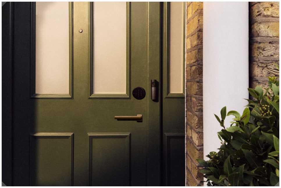LG Smart Deadbolt Lock on a green front door